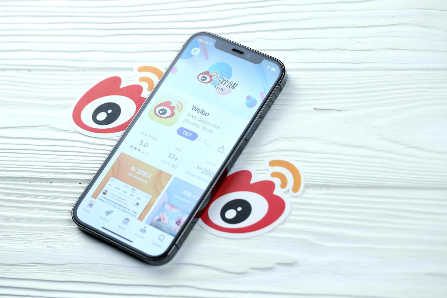 KHARKOV, UKRAINE - MARCH 5, 2021 Sina Weibo icon and application from App store on iPhone 12 pro display screen on white table photo
