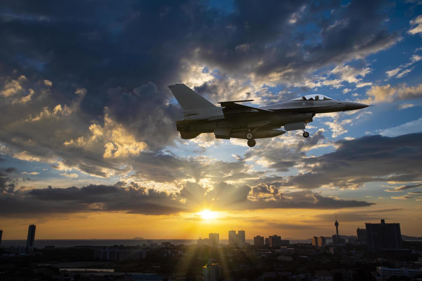 Silhouette airplane with beautiful colorful sunset sky background. photo