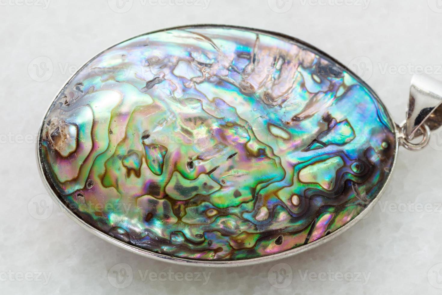 cabochon from Abalone haliotis shell on white photo