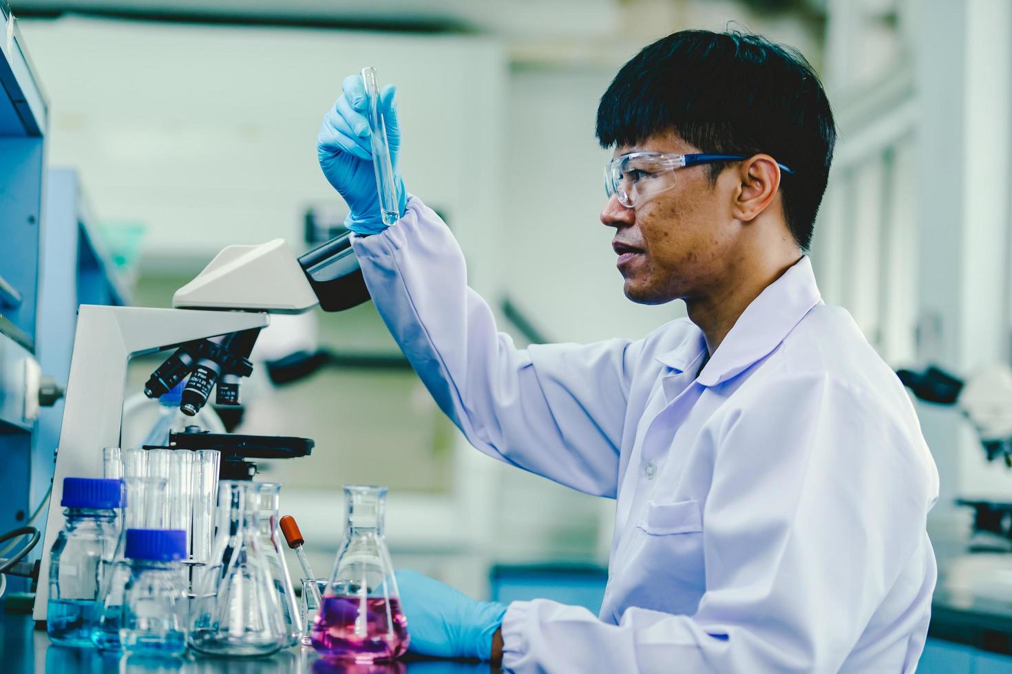 Scientist analyzing medical sample in laboratory 13000104 Stock Photo