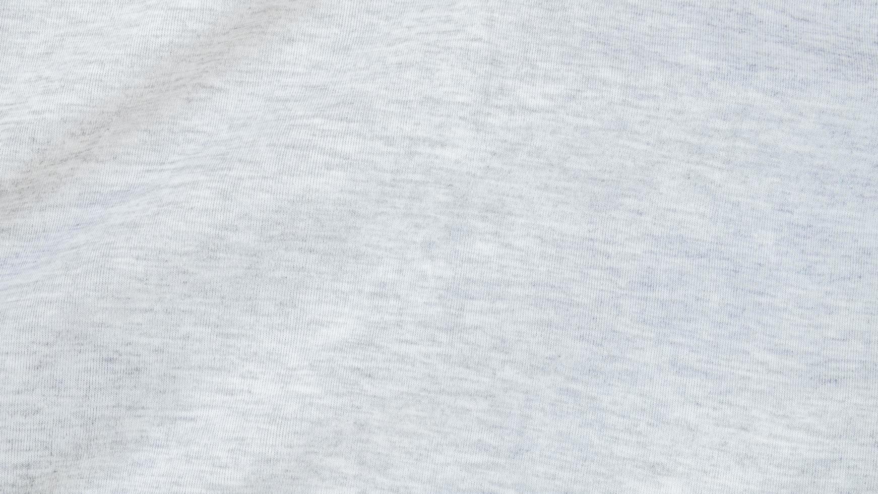 High resolution, detail shot of soft white gray jersey fabric background. Polyester and cotton clothing wallpaper with copy space for text. photo