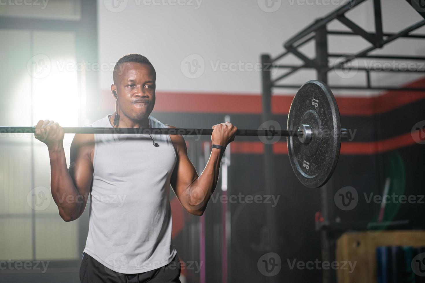 Strong adult black African men lift barbell to do crossfit