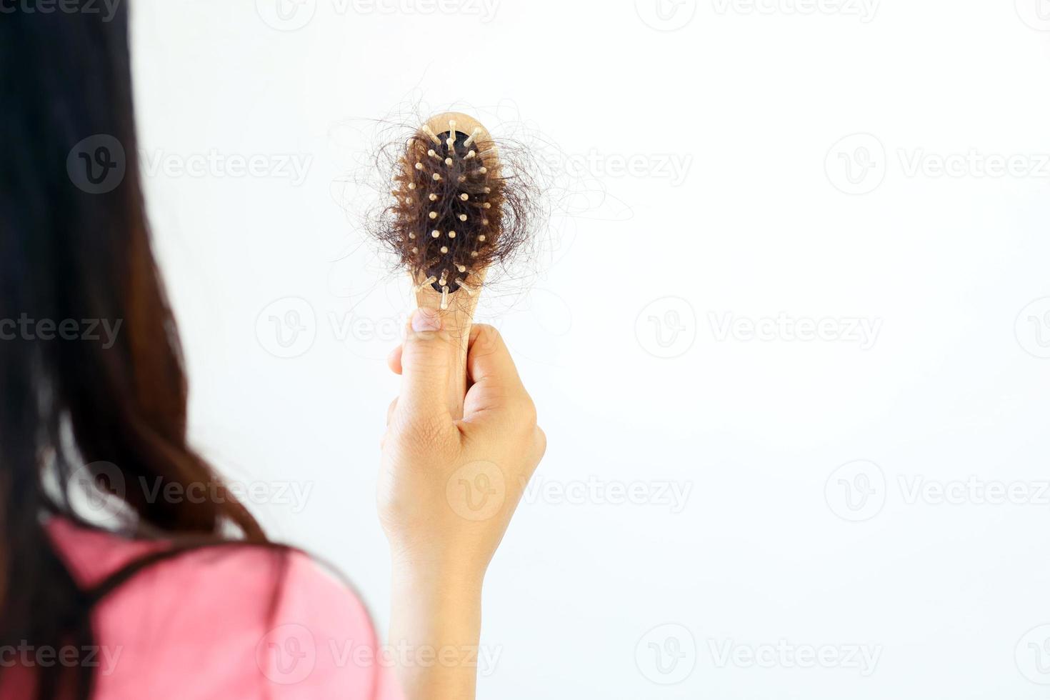 Hair loss in the brush of the woman photo