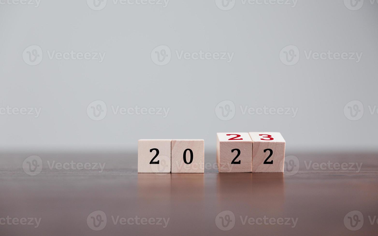 Target or goal with strategy plan-success business revenue concept. Start of new year 2023 businesses plan are present on wood cube. objective management, achievement startup, growth marketing idea. photo