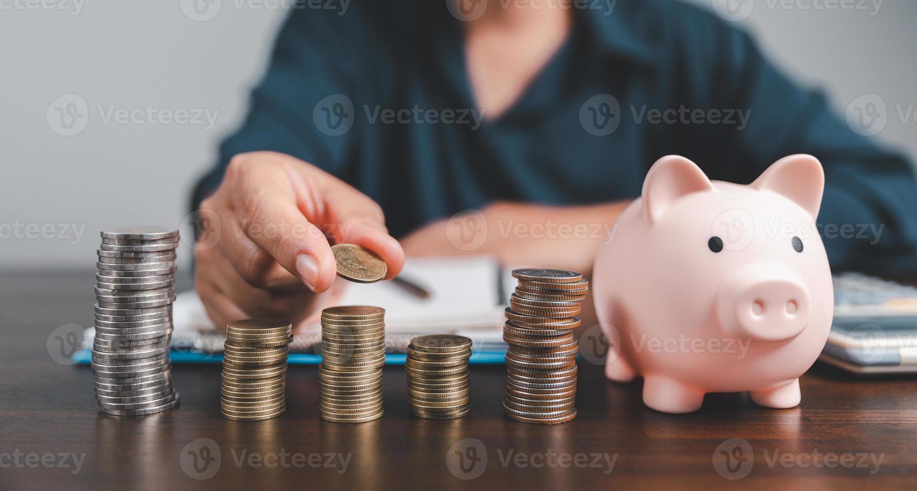 Saving investment banking finance concept. Stack of coins with piggy bank on the table. Growth of loan and investment business idea. Asset Management, Funds, Liabilities, Deposits, Income, Successful. photo