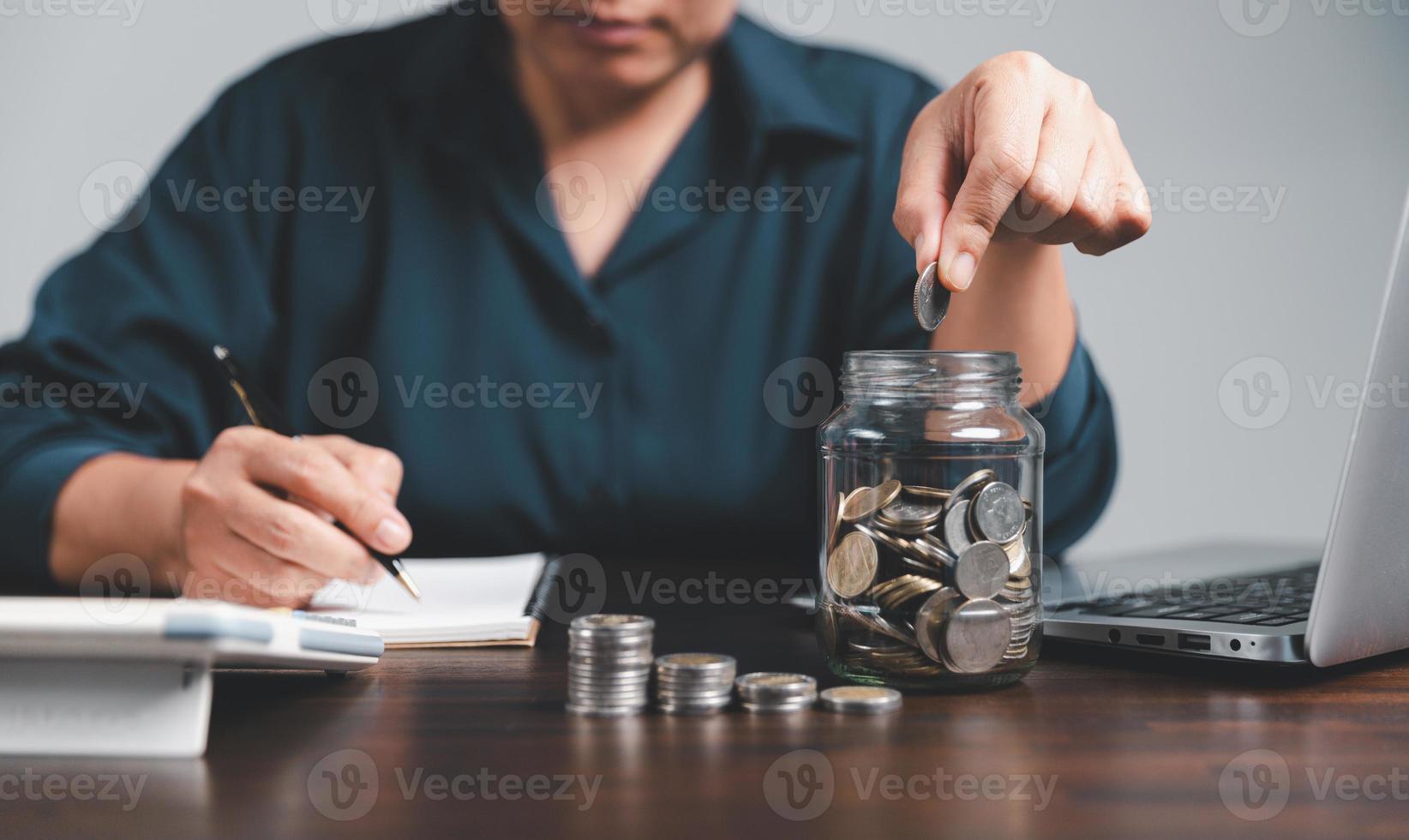 Saving investment banking finance concept. Stack of coins with piggy bank on the table. Growth of loan and investment business idea. Asset Management, Funds, Liabilities, Deposits, Income, Successful. photo