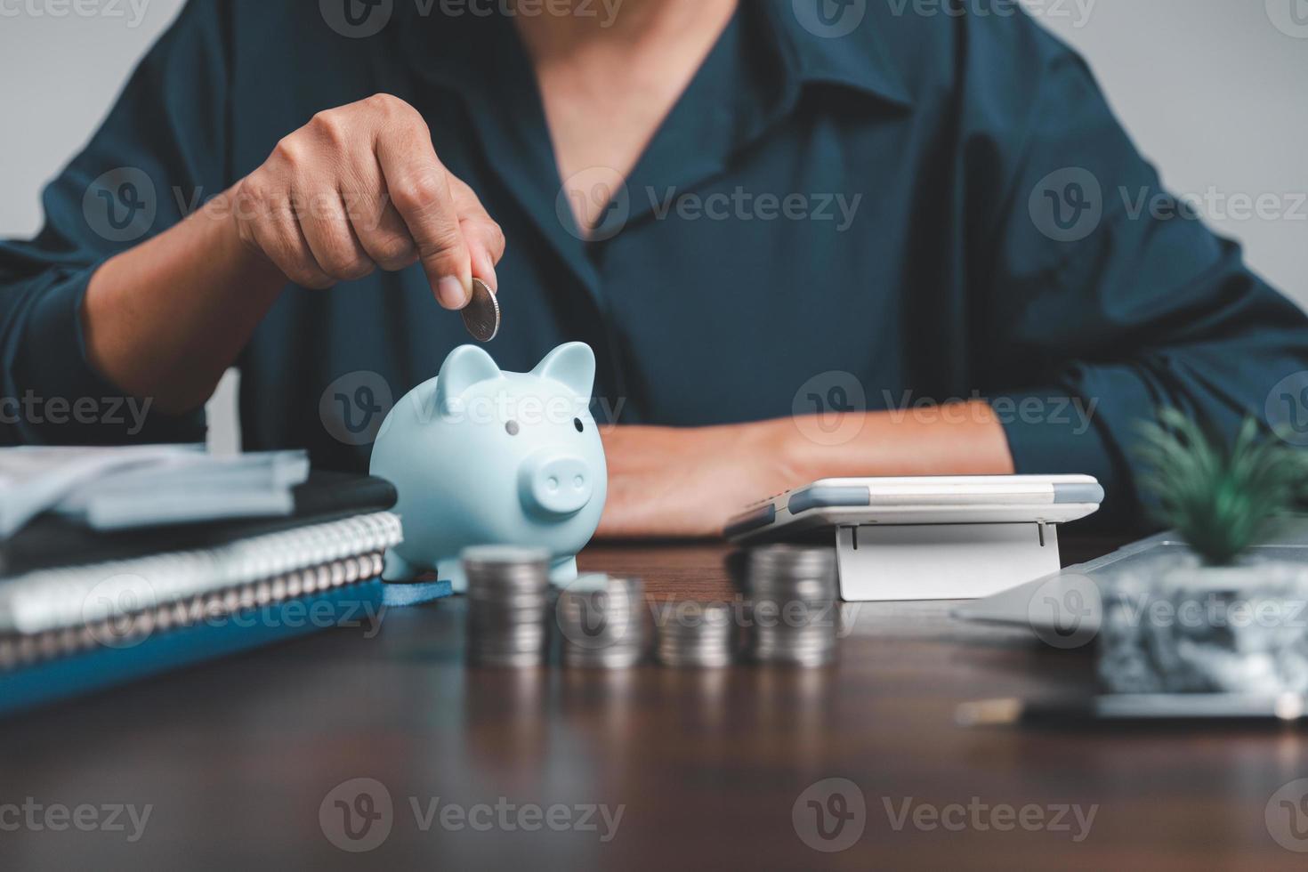 Saving investment banking finance concept. Stack of coins with piggy bank on the table. Growth of loan and investment business idea. Asset Management, Funds, Liabilities, Deposits, Income, Successful. photo