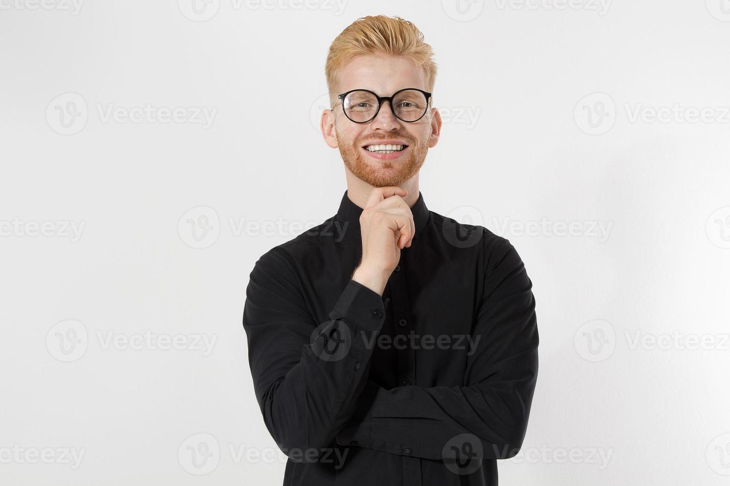 Happy Stylish guy in black shirt and glasses. Folded arms, copy space. Successful young, Entrepreneur concept. Redheaded man with red beard. Start up, young founder concept isolate on white background photo