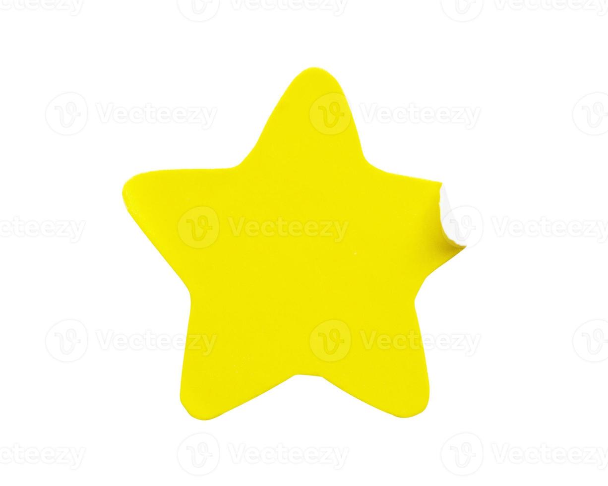 Yellow star shape paper sticker label isolated on white background photo