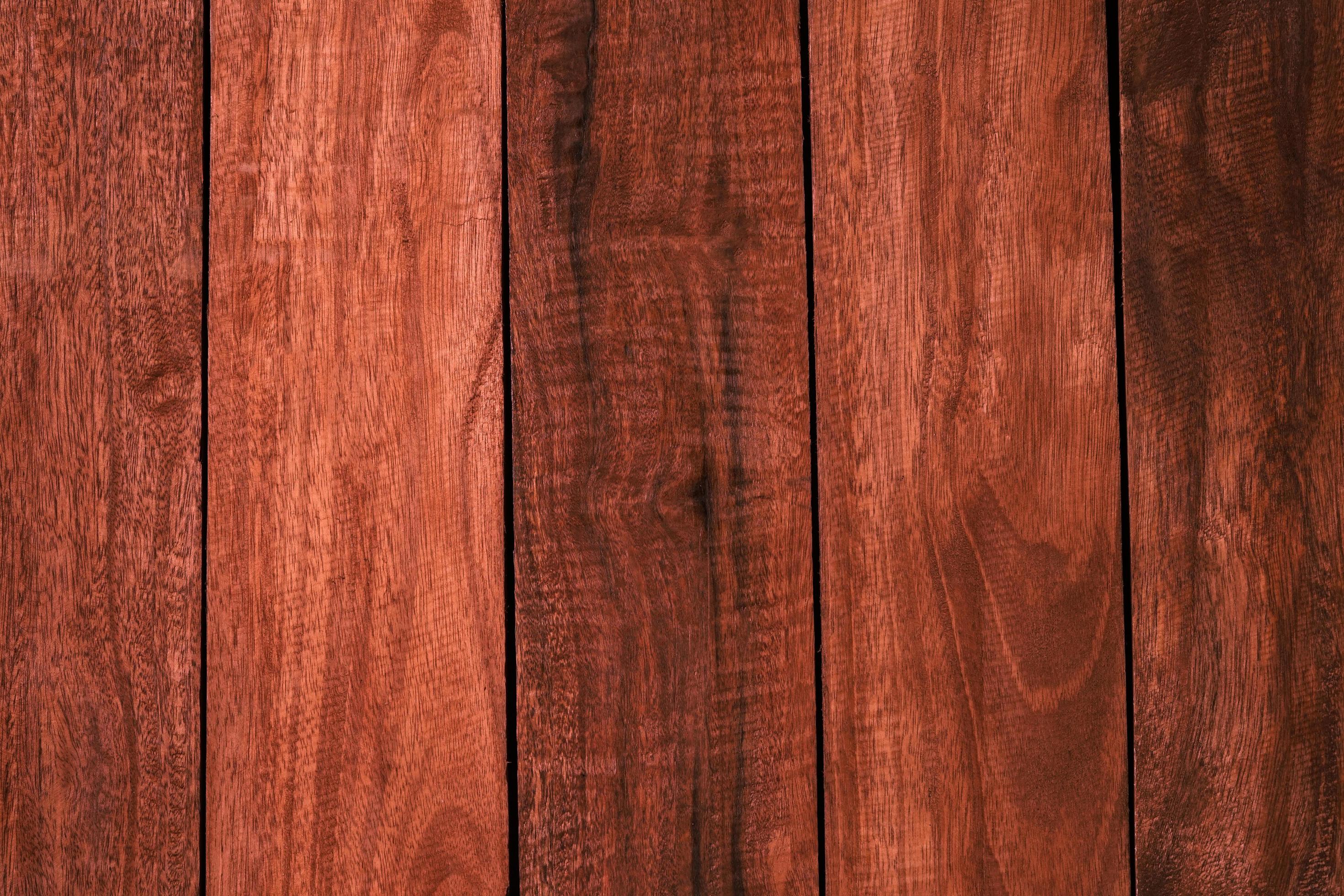 Los tablones de madera marrón texturan un fondo de alta calidad hecho