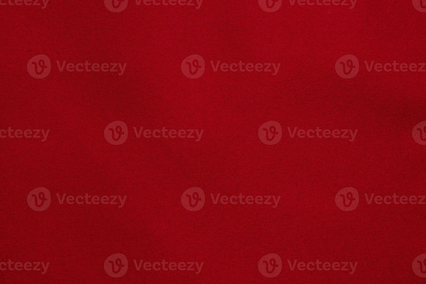 Red fabric texture background close up photo
