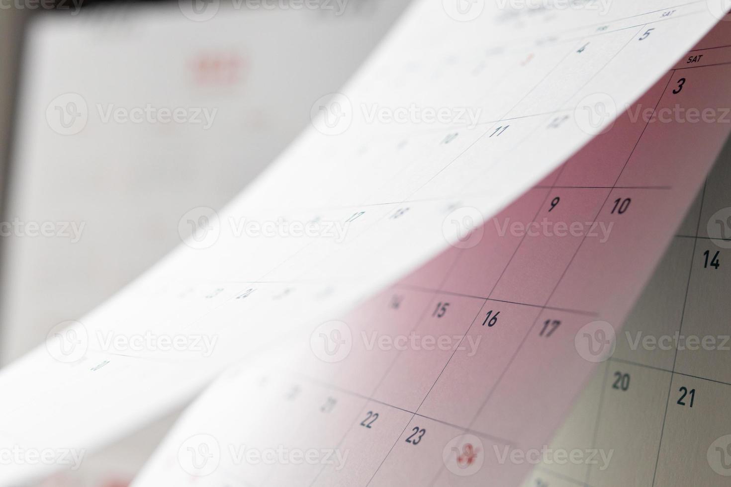 Abstract blur calendar page flipping sheet close up background business schedule planning appointment meeting concept photo