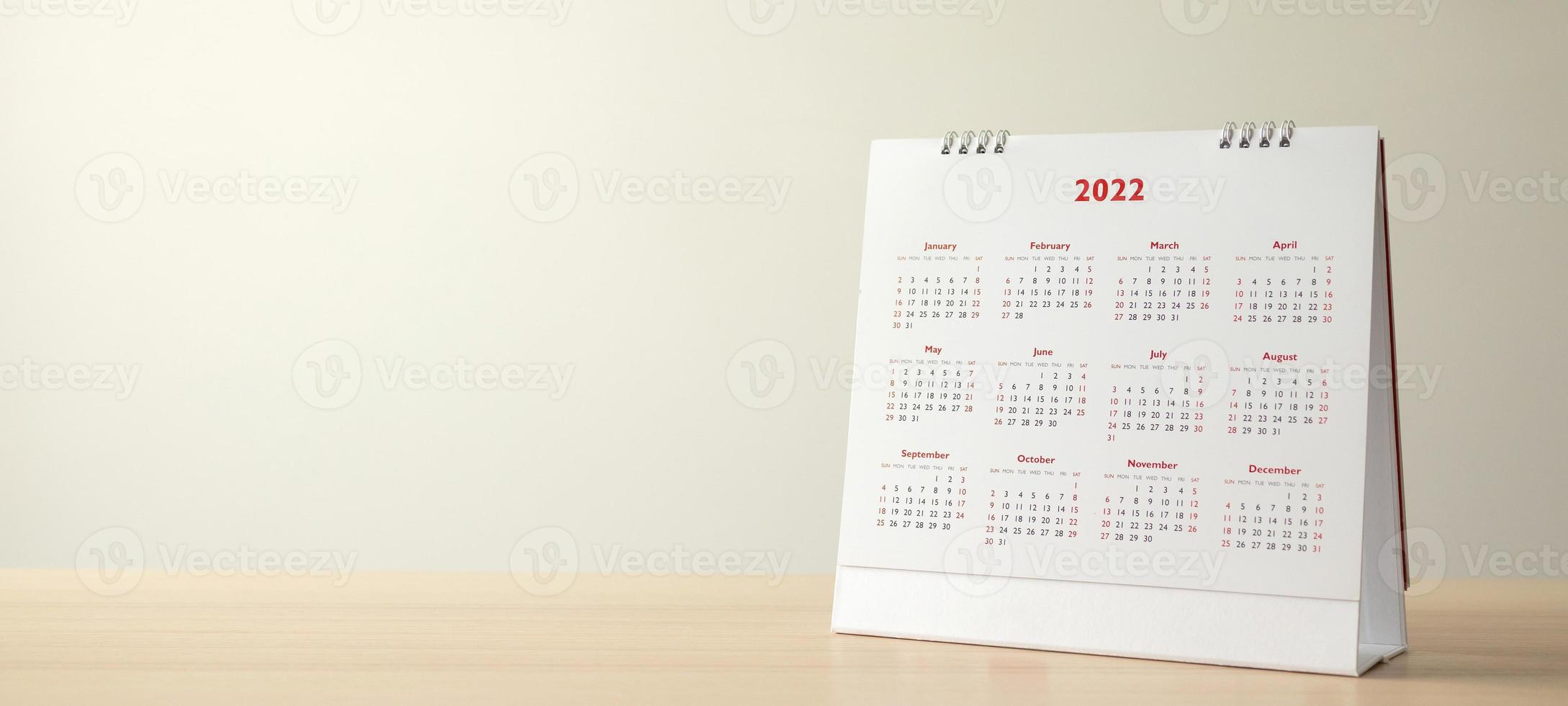 Close up 2022 calendar page dates and month background business planning appointment meeting concept photo