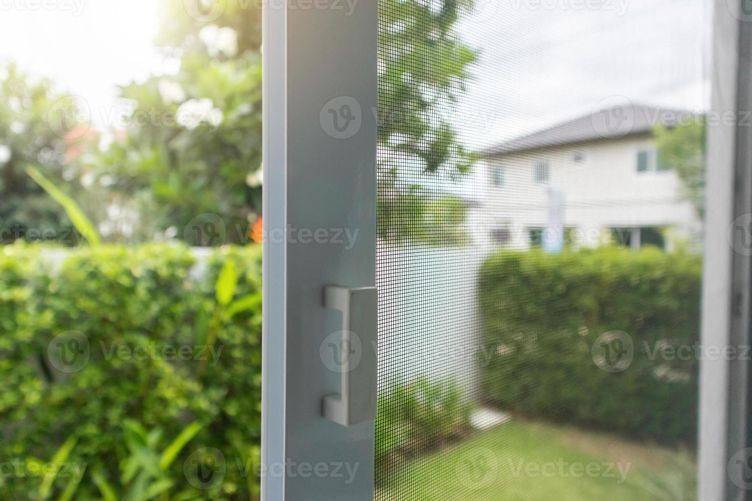mosquito net wire screen on house window protection against insect photo