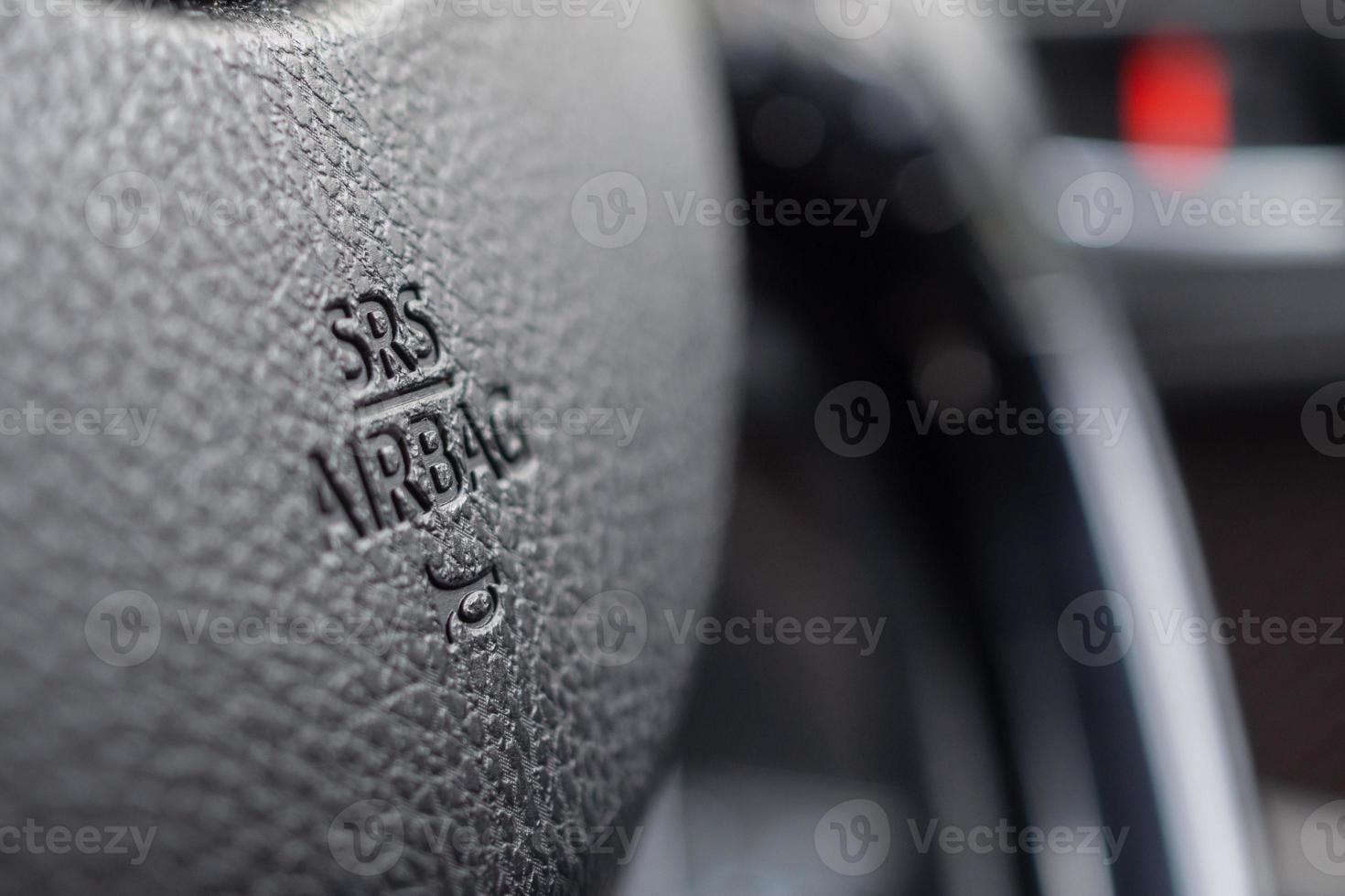 Safety airbag sign on car steering wheel with horn icon photo