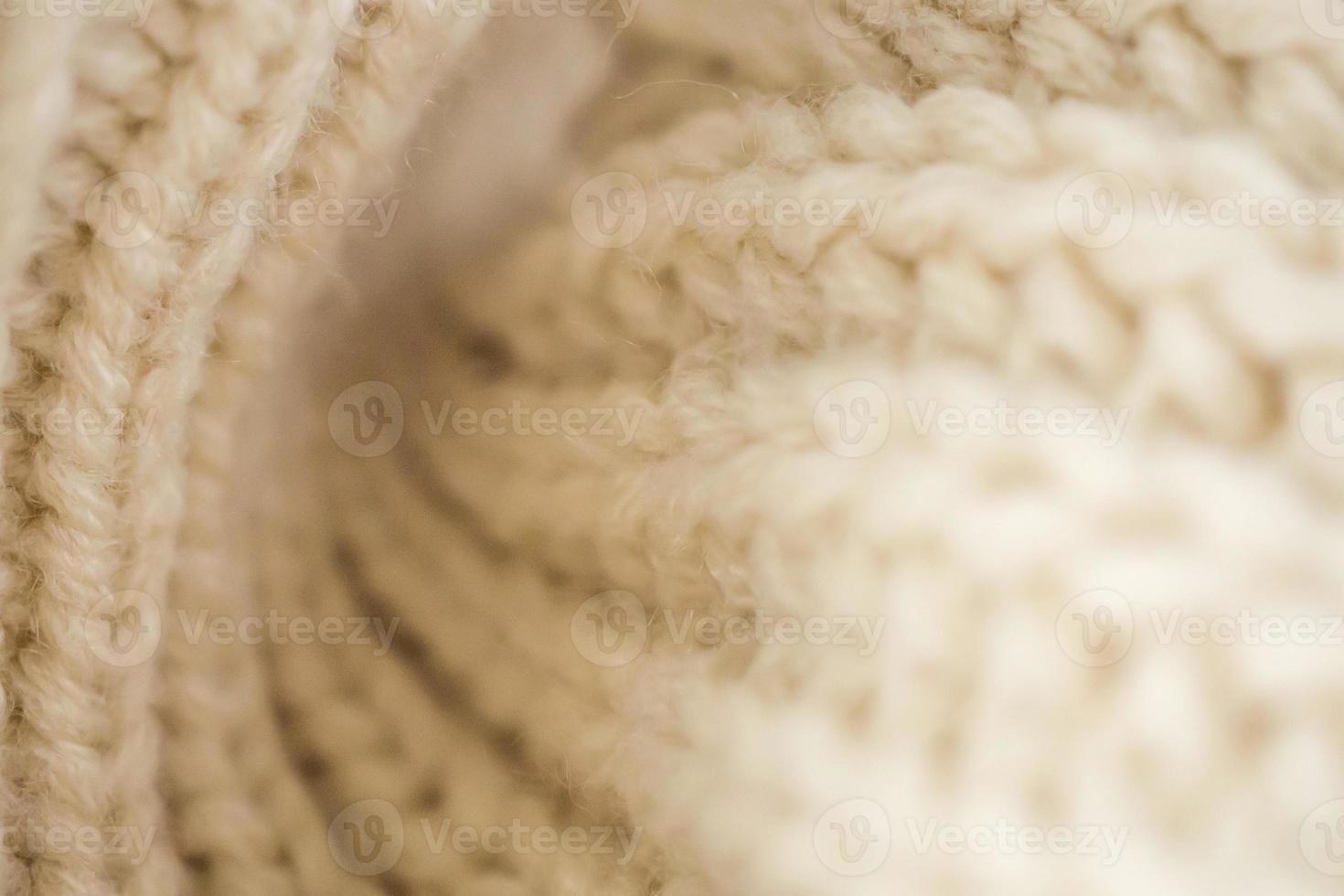 Primer plano de fondo de tela de lana de punto beige foto