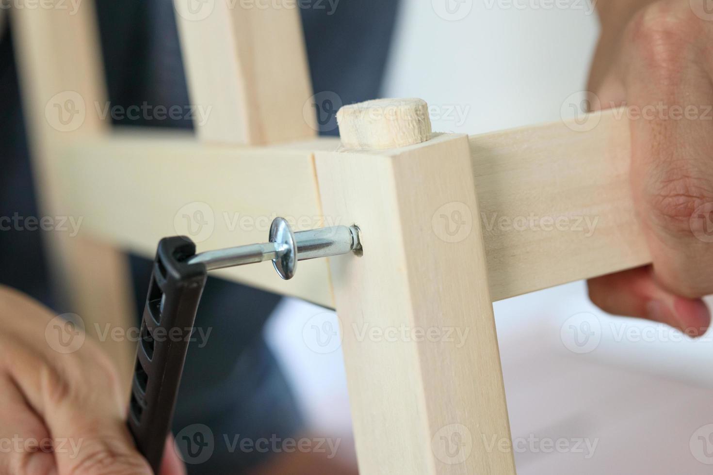 Assembly wooden furniture at home using screw allen photo