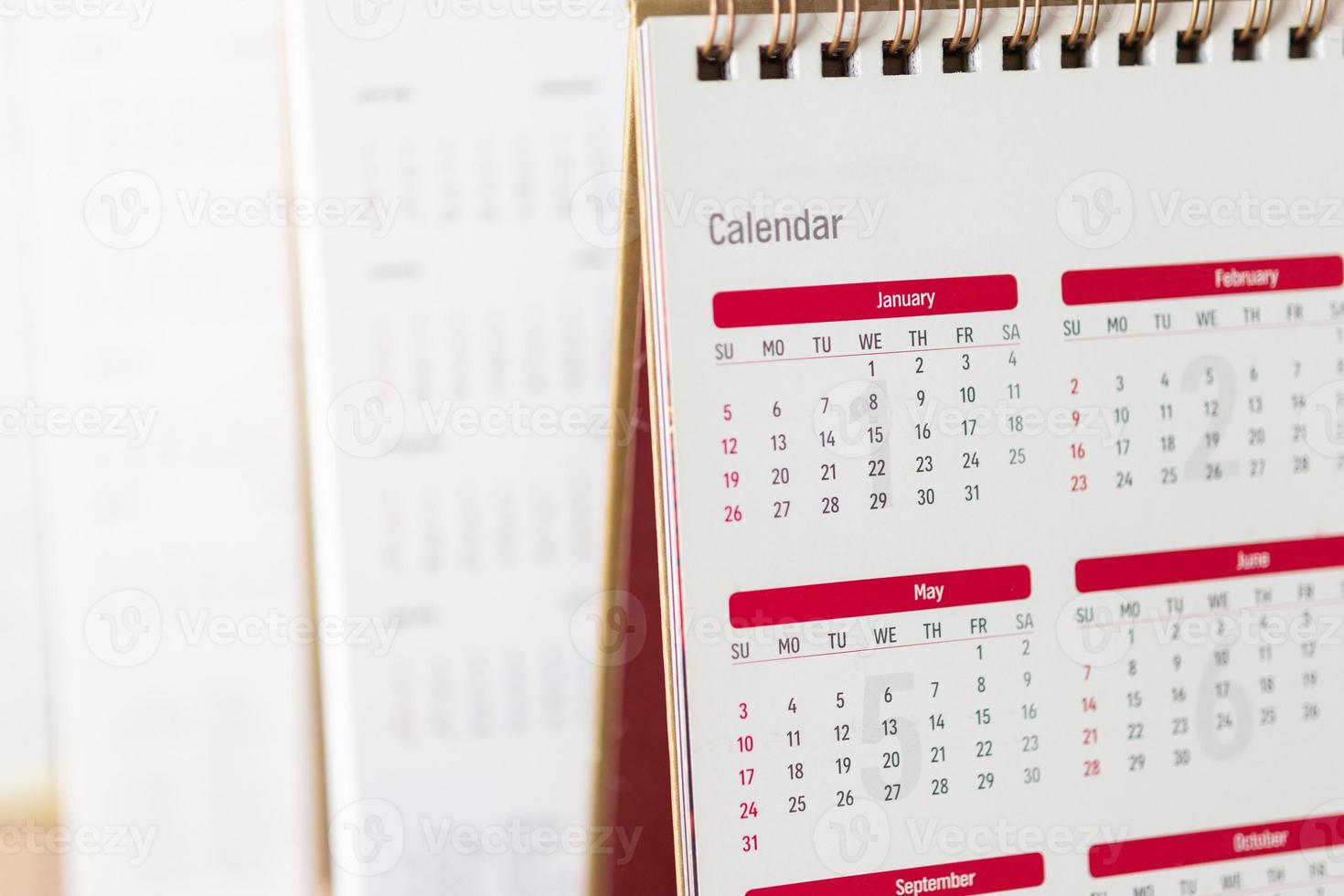 Close up calendar page dates and month background business planning appointment meeting concept photo