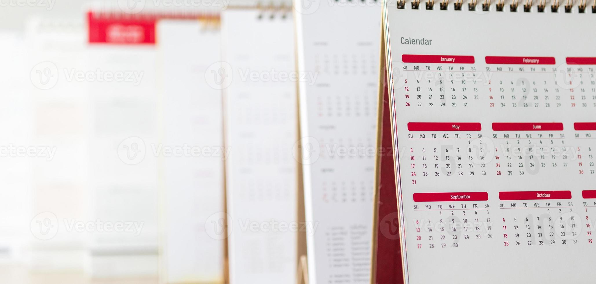 Close up calendar page dates and month background business planning appointment meeting concept photo