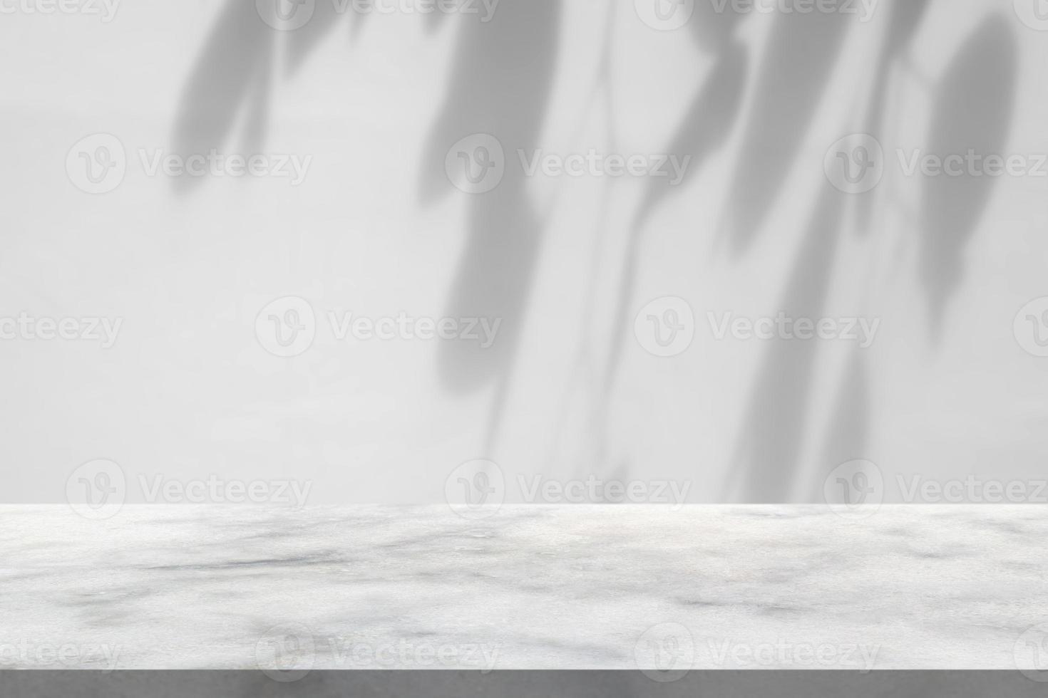 Marble table with tree shadow drop on white wall background for mockup product display photo