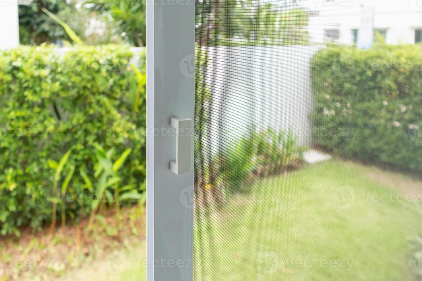 mosquito net wire screen on house window protection against insect photo