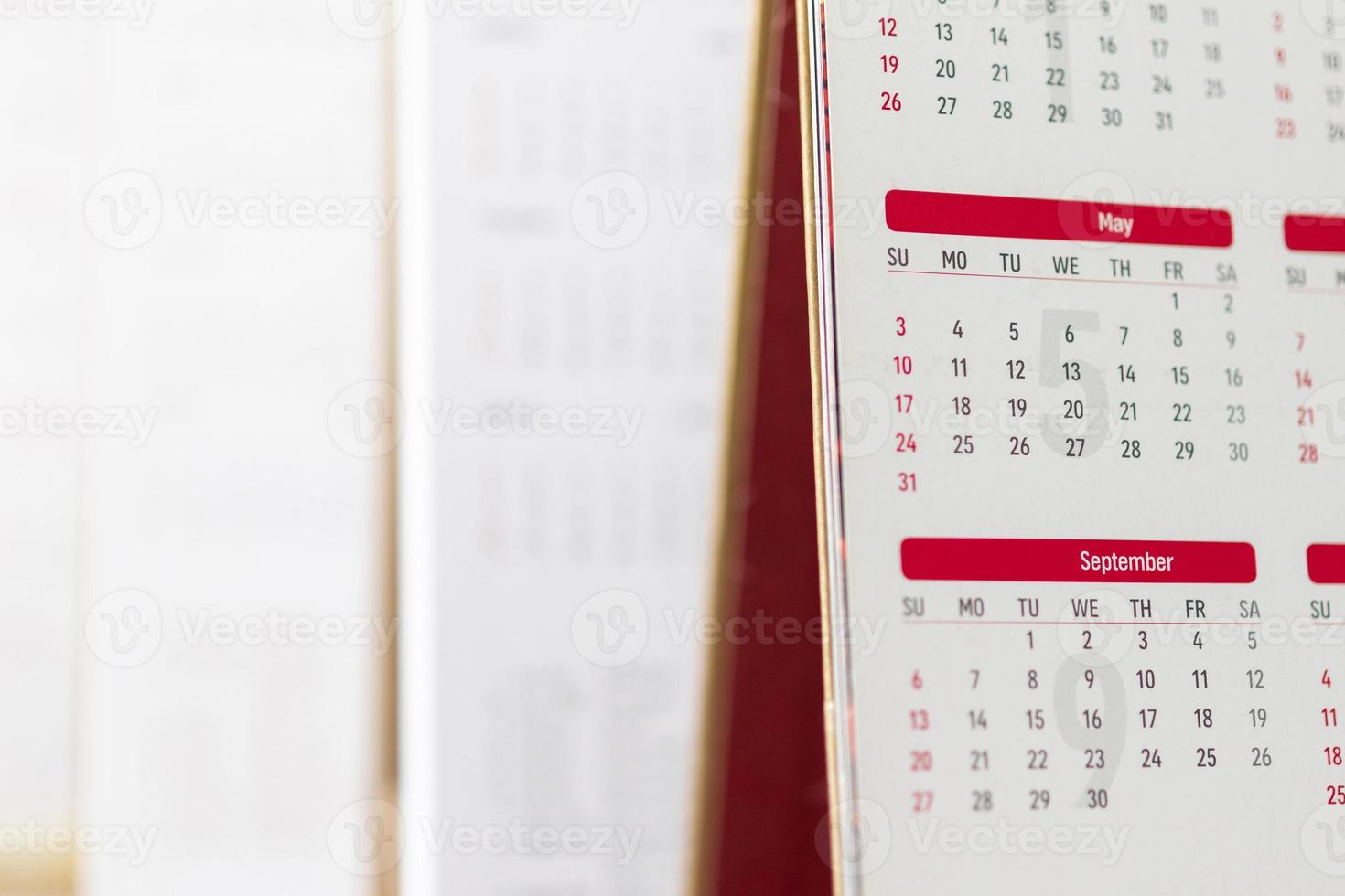 Close up calendar page dates and month background business planning appointment meeting concept photo