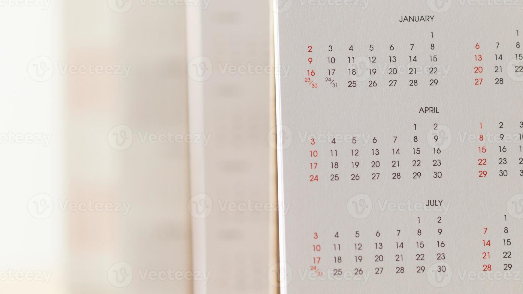 Close up calendar page dates and month background business planning appointment meeting concept photo