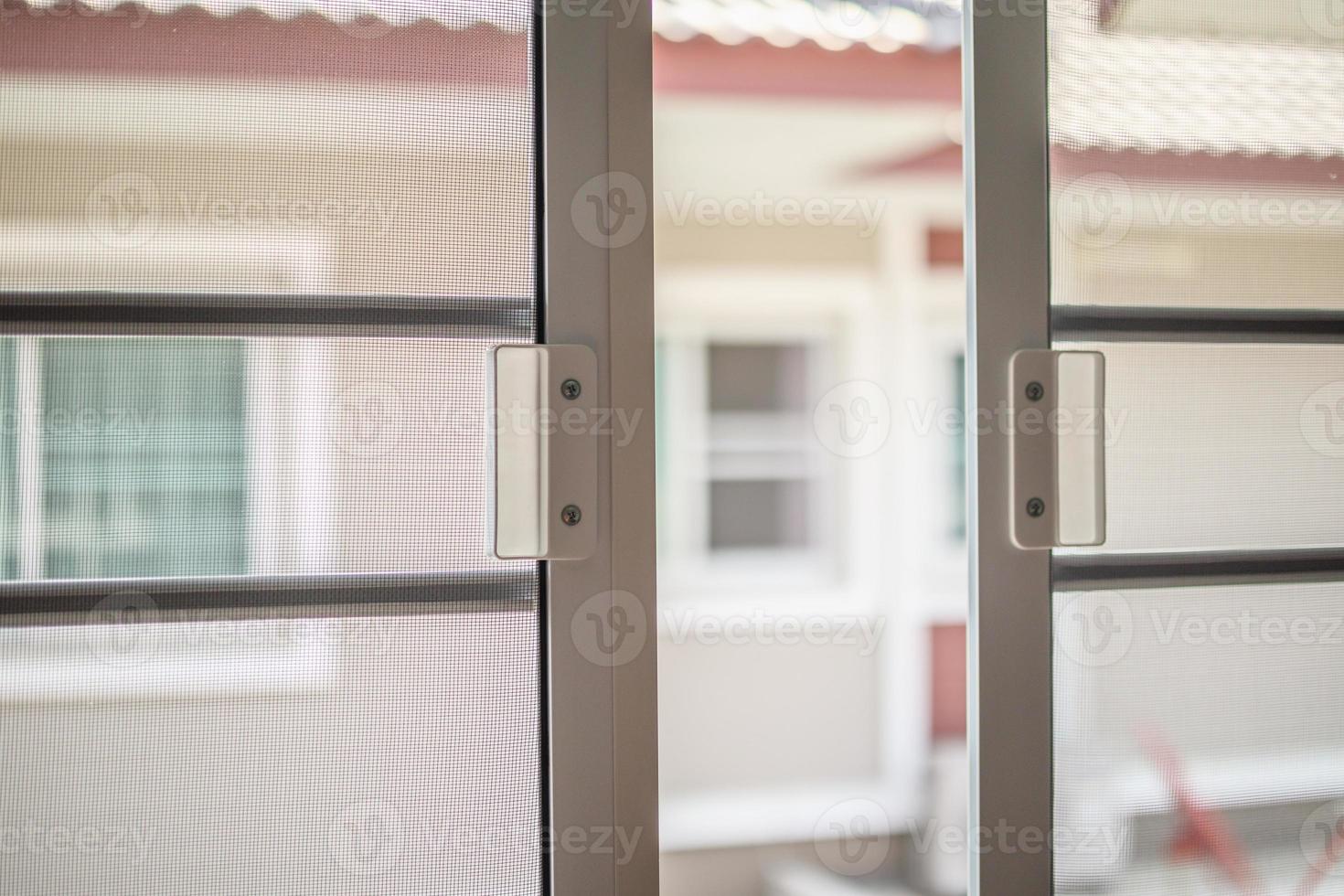 mosquito net wire screen on house window protection against insect photo