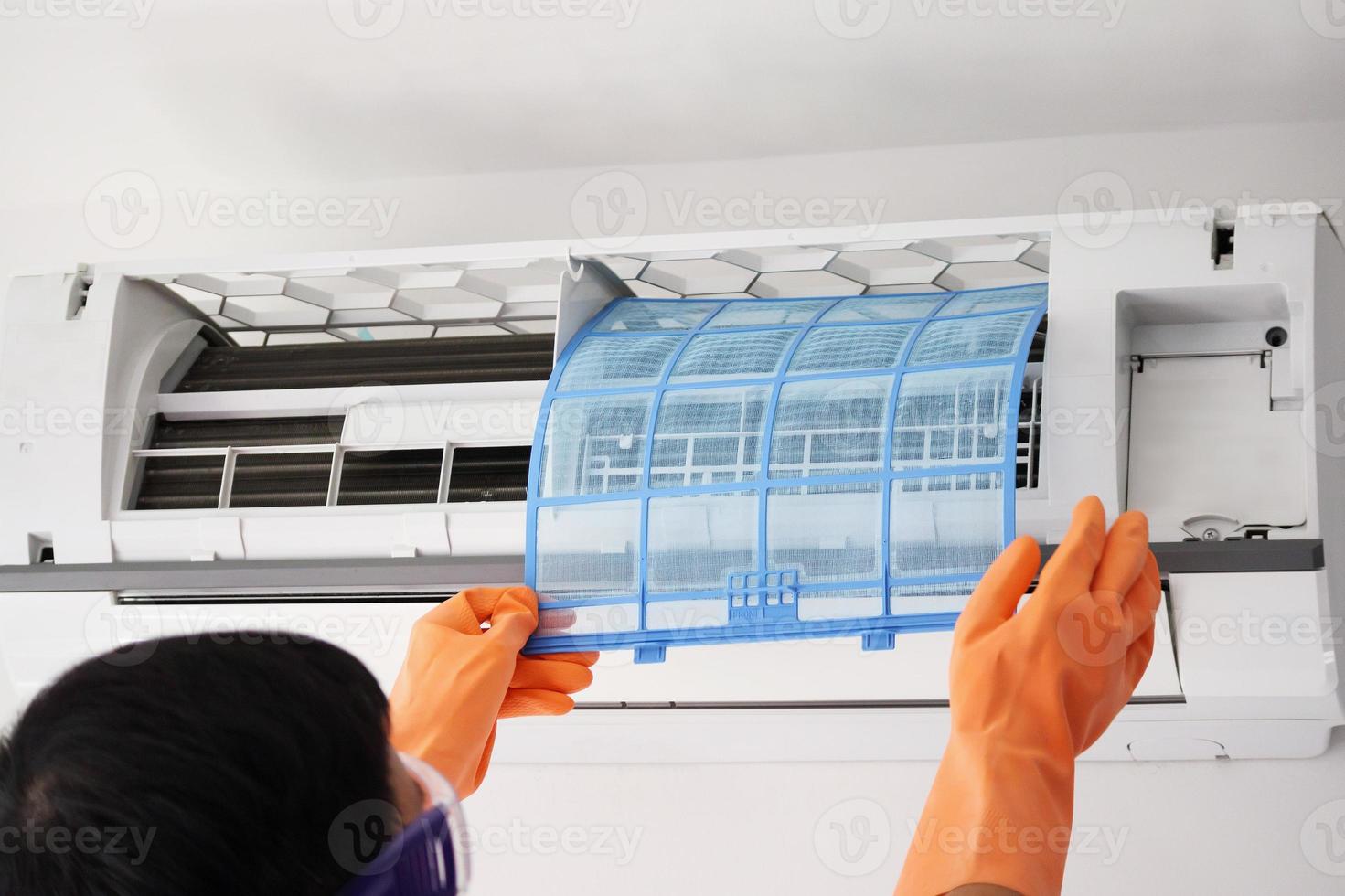 Asian man hand hold air conditioner filter cleaning concept photo