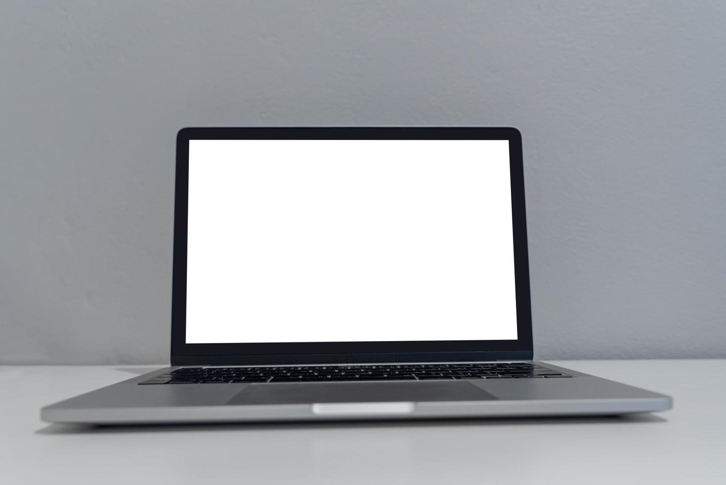 Computer laptop mock up with blank screen on desk.modern technology concept. photo