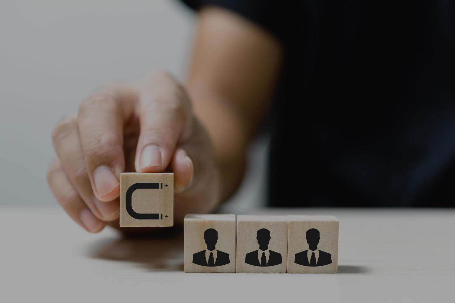 Hand put wooden cubes with Inbound marketing icons and symbols on table and copy space.Business concepts. photo