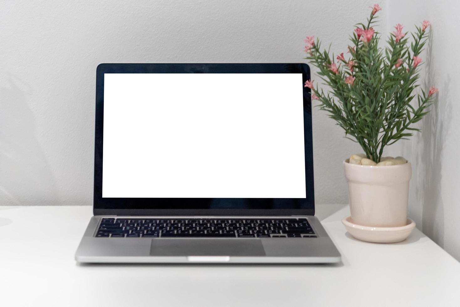 Computer laptop mock up with blank screen on desk.modern technology concept. photo