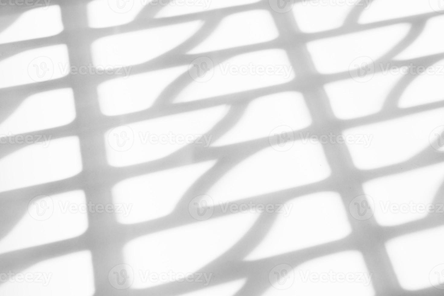 Abstract shadow drop on white wall background photo