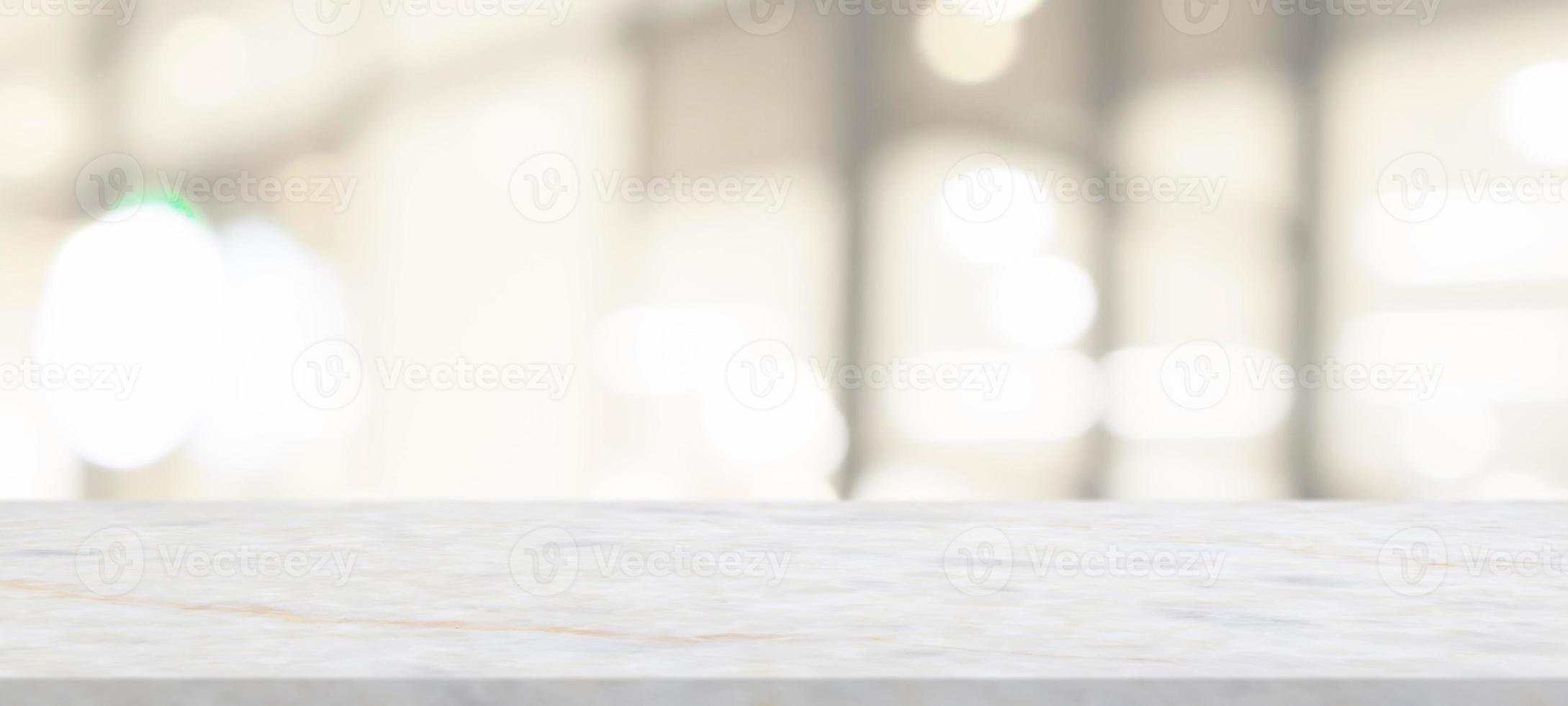 marble table top with blurred abstract cafe restaurant interior background photo