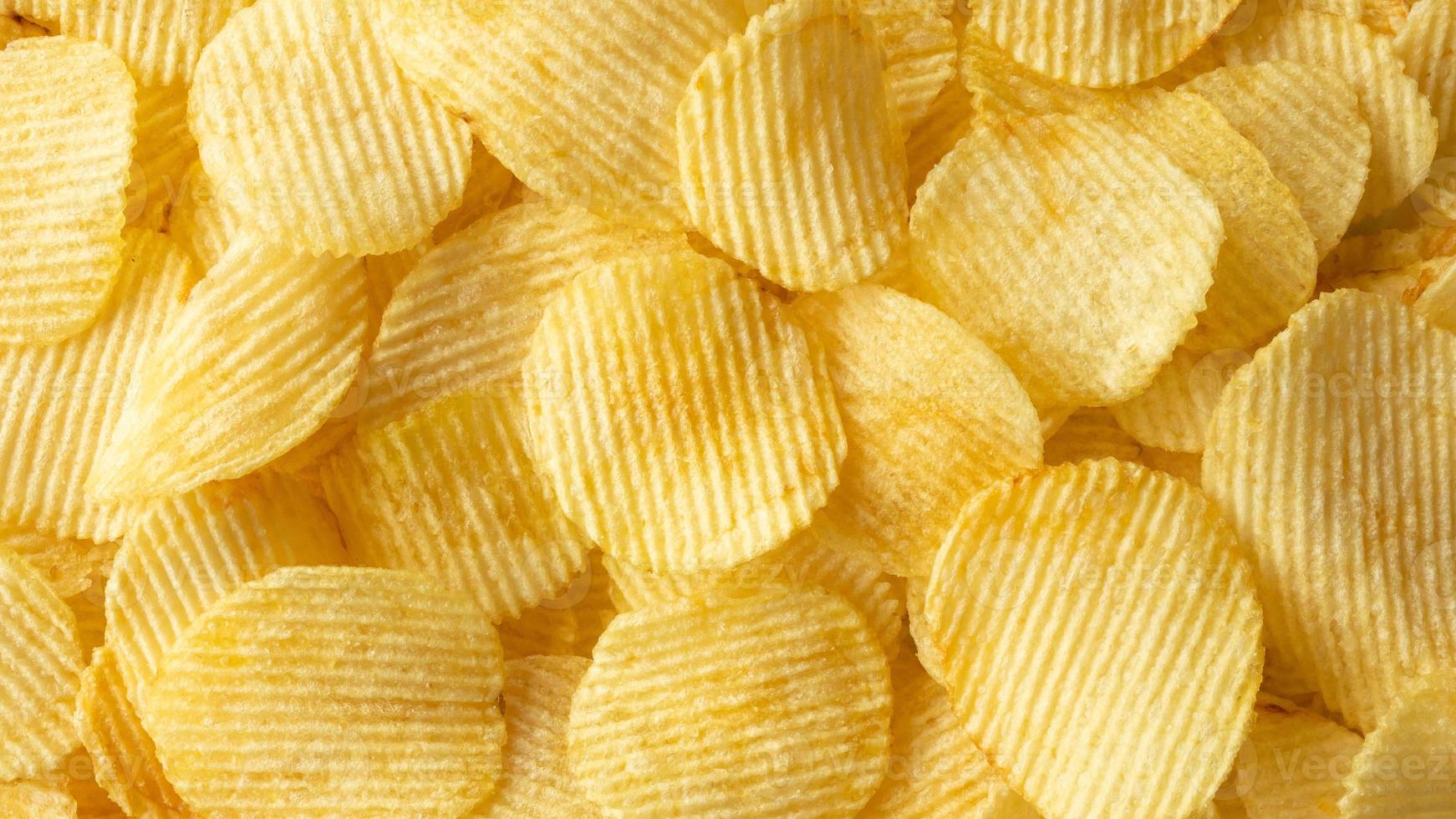 crispy golden potato chips snack texture background photo