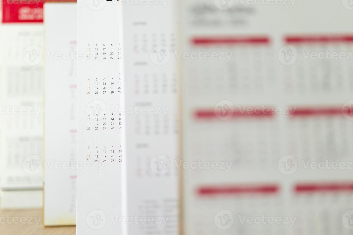 Close up calendar page dates and month background business planning appointment meeting concept photo