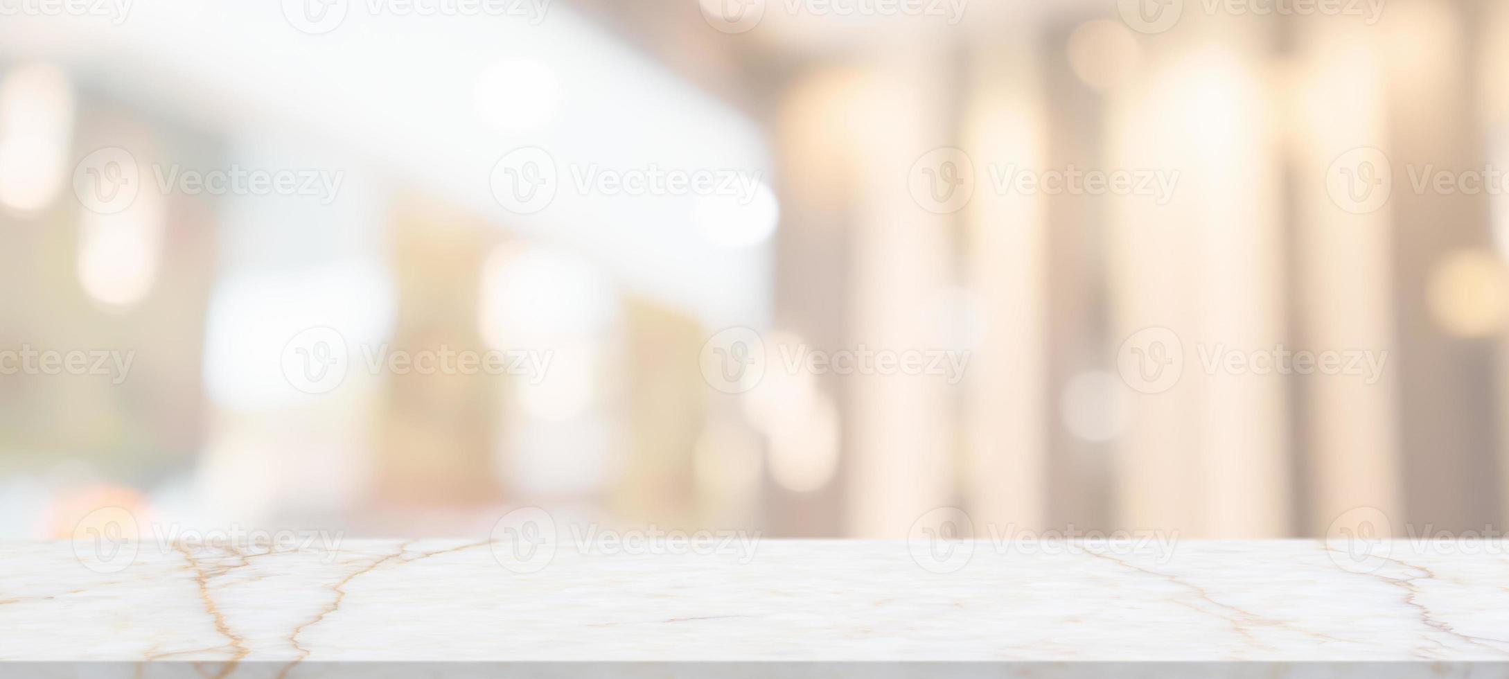 marble table top with blurred abstract cafe restaurant interior background photo