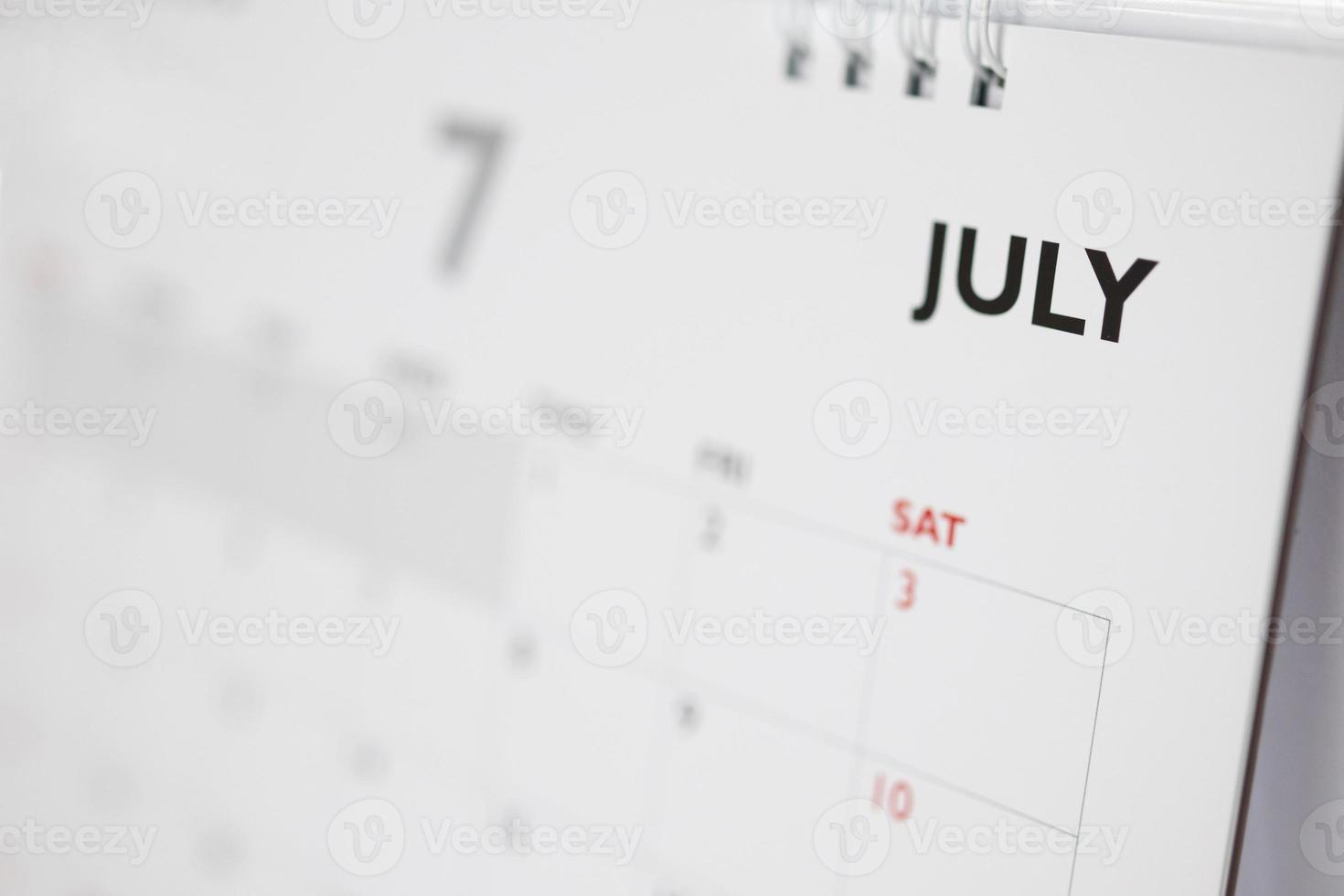 July calendar page with months and dates business planning appointment meeting concept photo