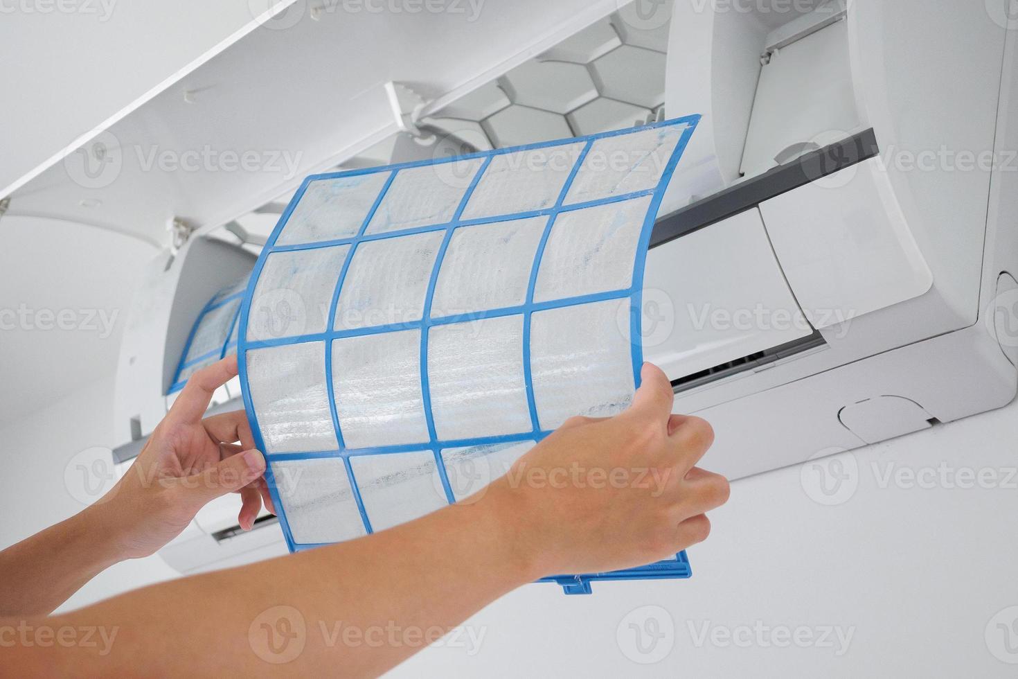 man hand hold air conditioner filter cleaning concept photo