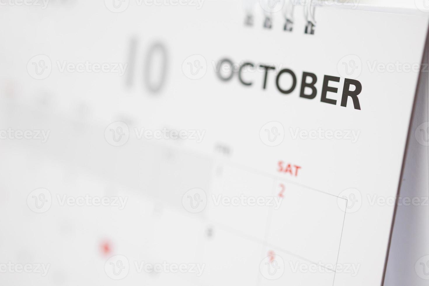 October calendar page with months and dates business planning appointment meeting concept photo