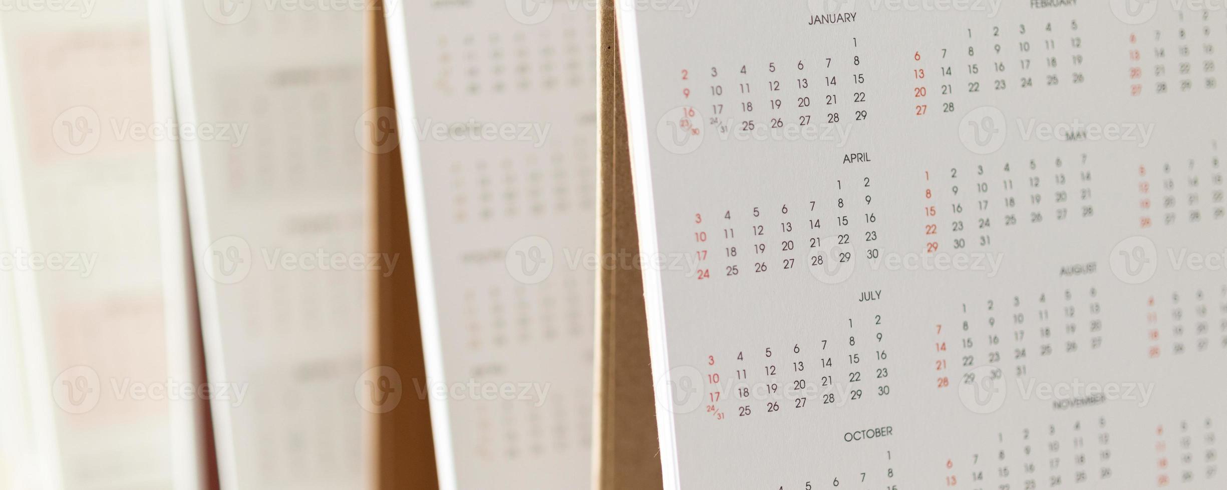 Close up calendar page dates and month background business planning appointment meeting concept photo