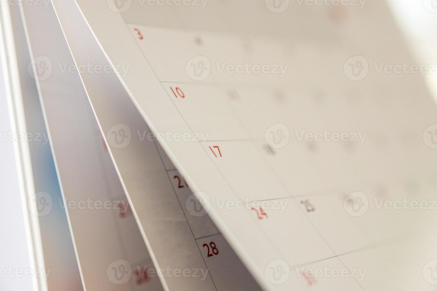 Abstract blur calendar page flipping sheet close up background business schedule planning appointment meeting concept photo