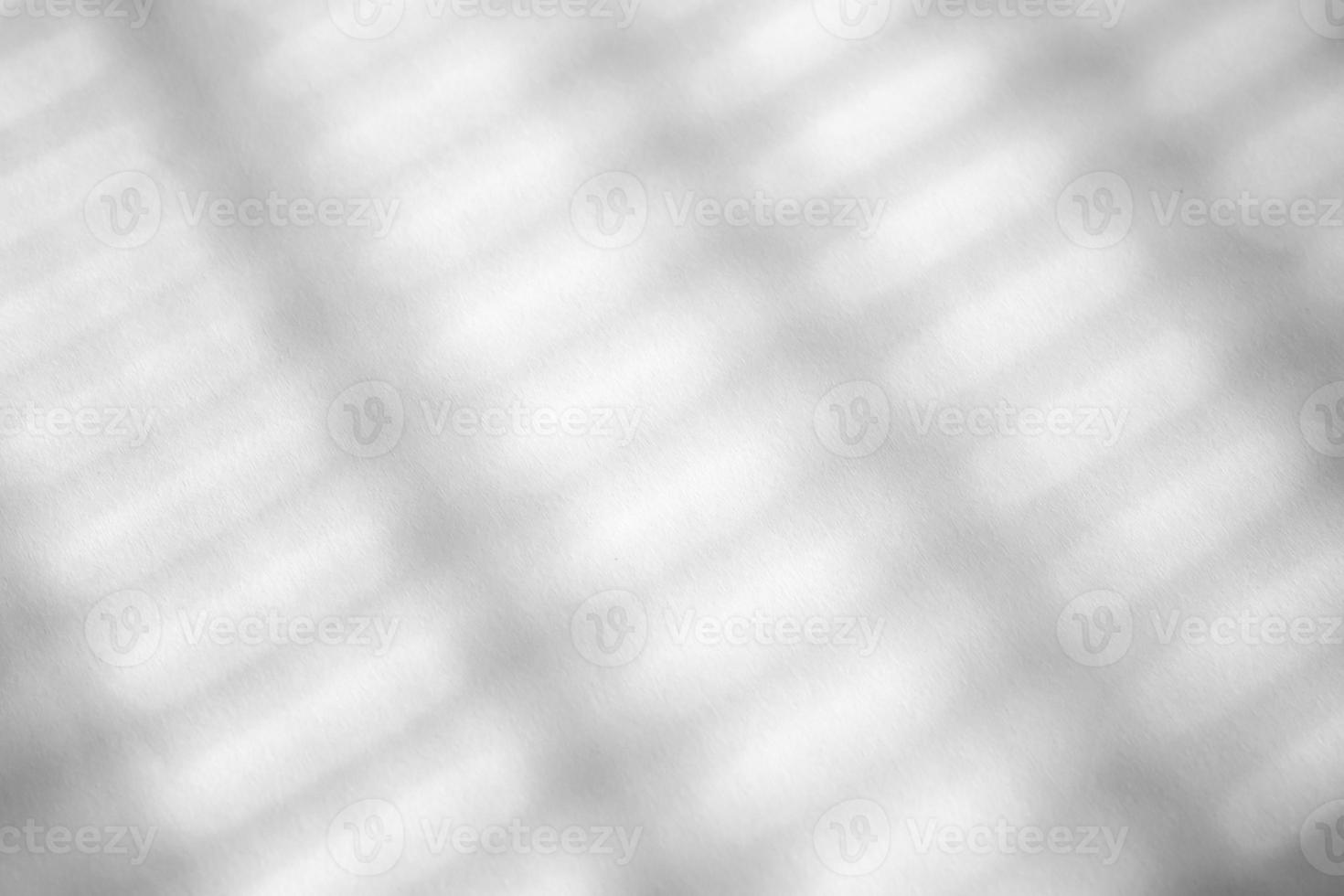 Abstract shadow drop on white wall background photo