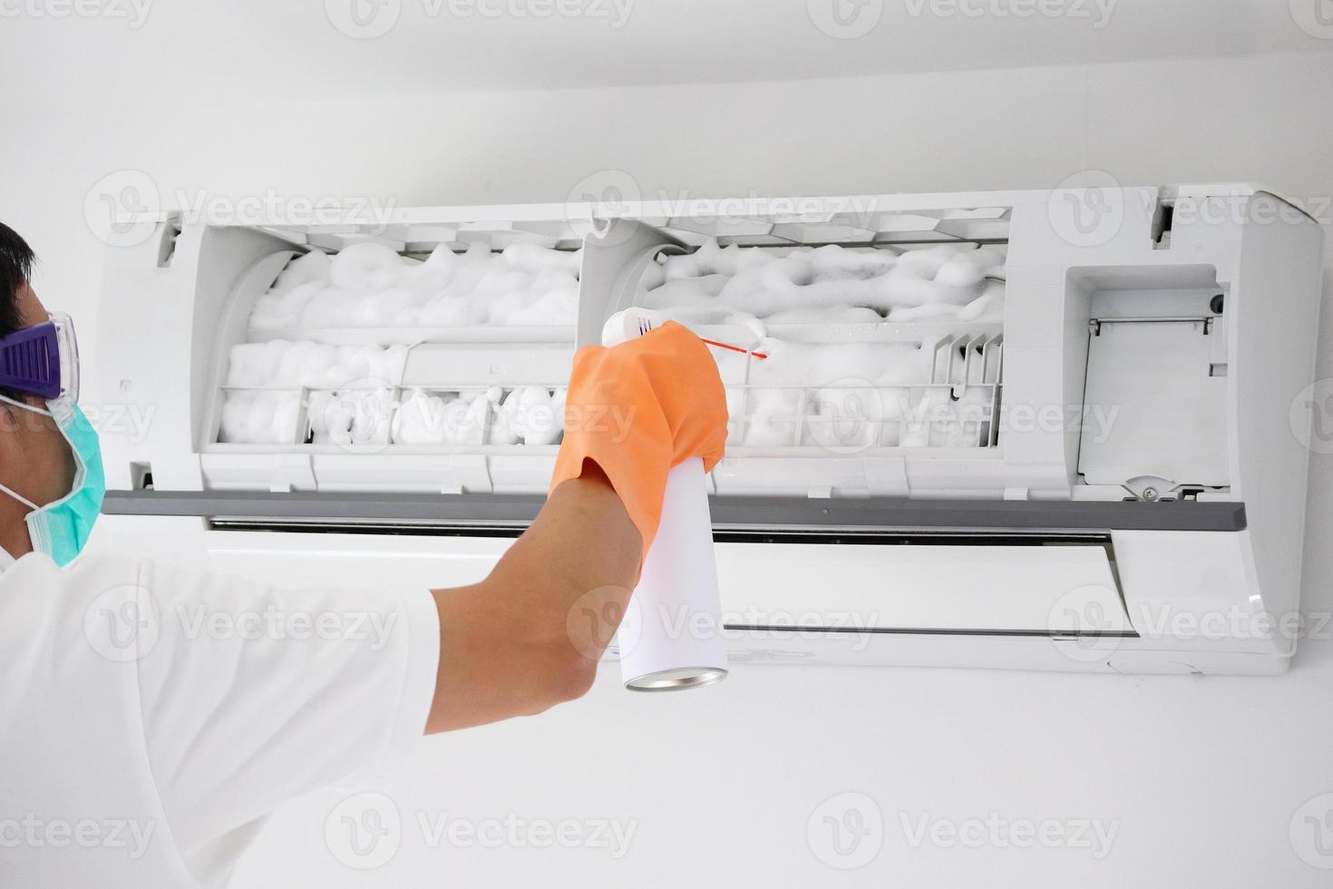 air conditioner cleaning with spray foam cleaner photo