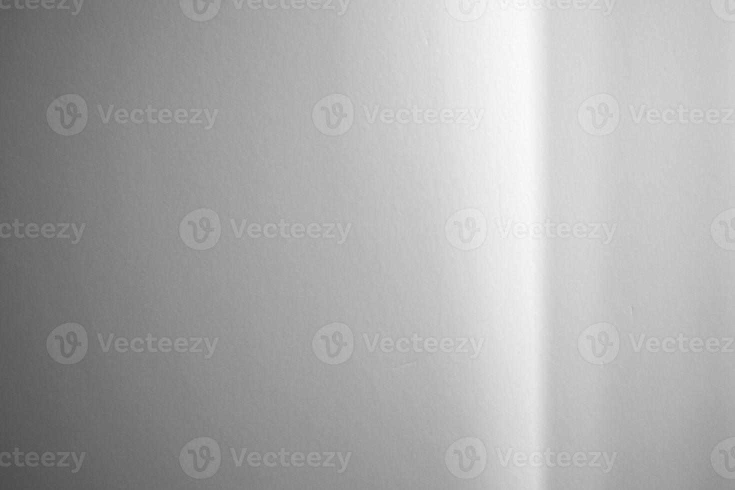 Window shadow drop on white wall background photo