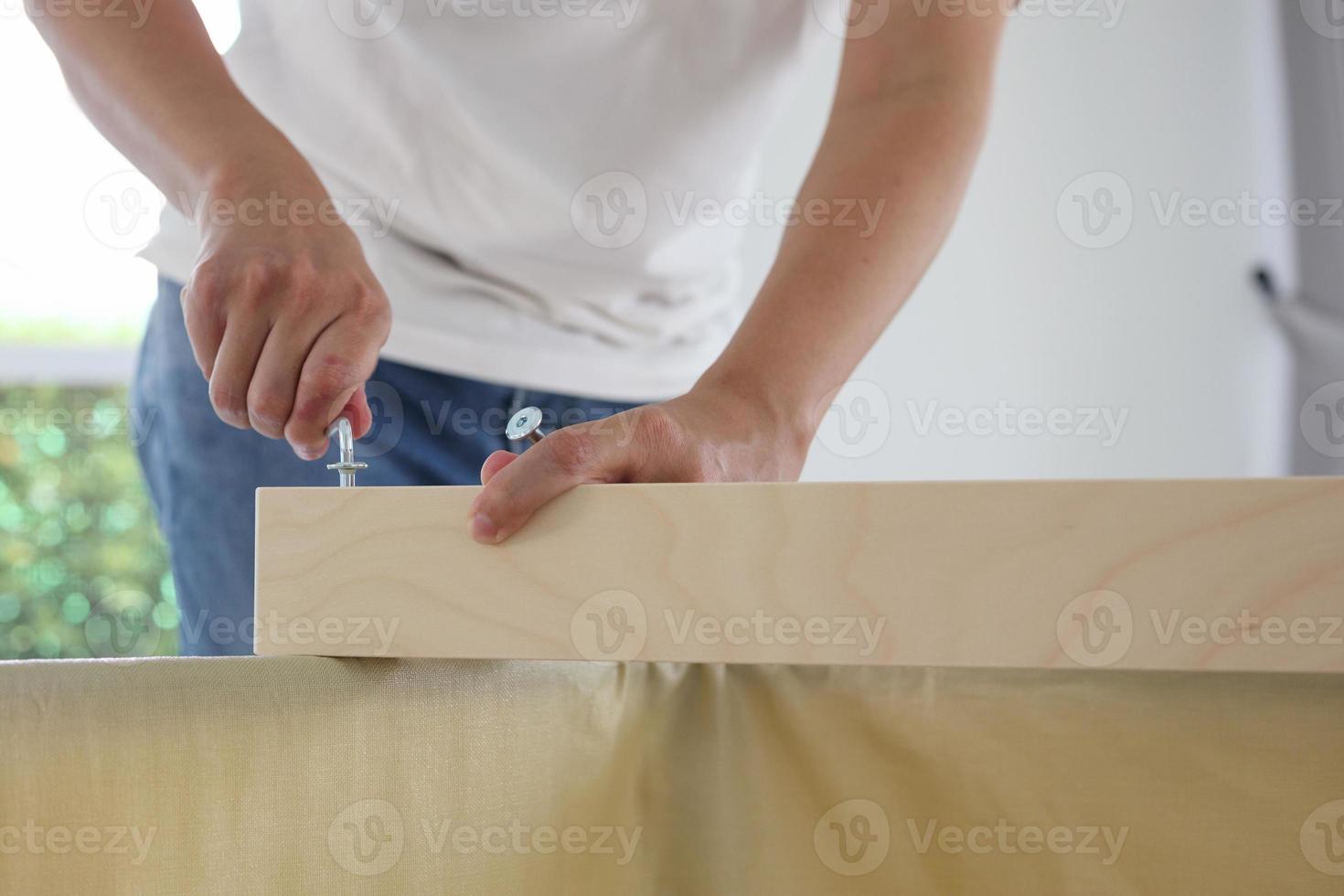 Assembly wooden furniture at home using screw allen photo