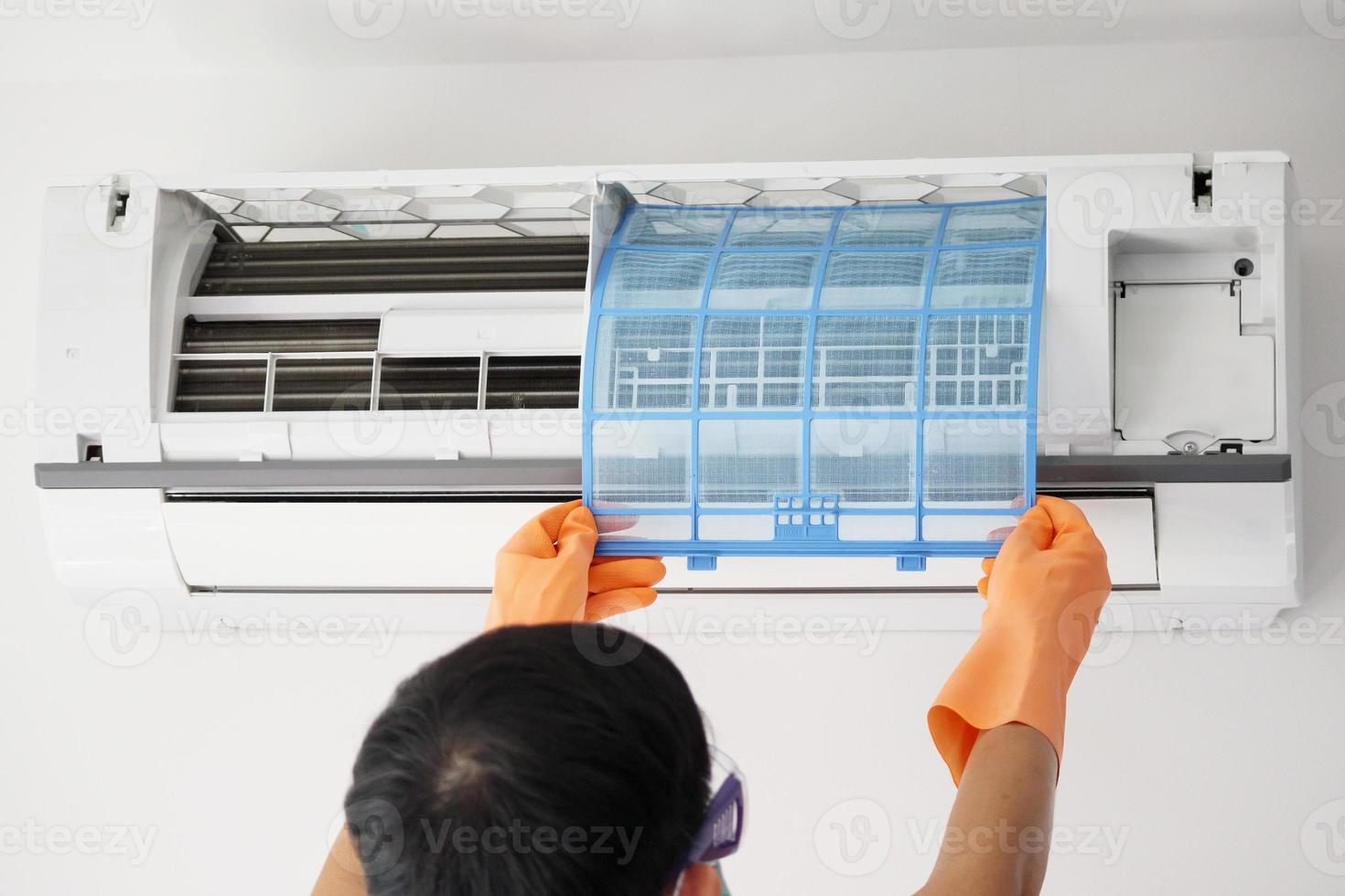 Asian man hand hold air conditioner filter cleaning concept photo