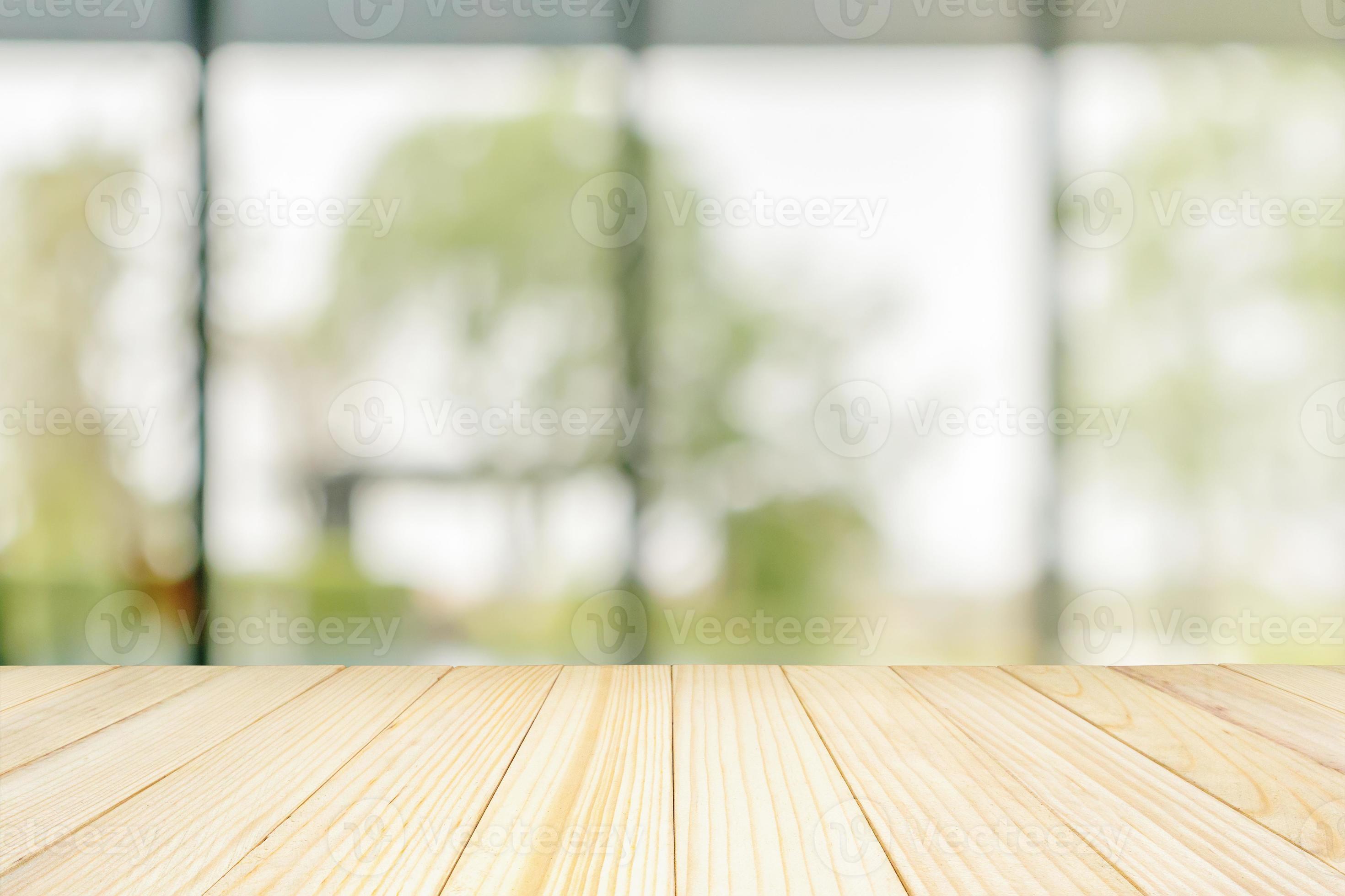 Empty wood table top with blurred window background for product display