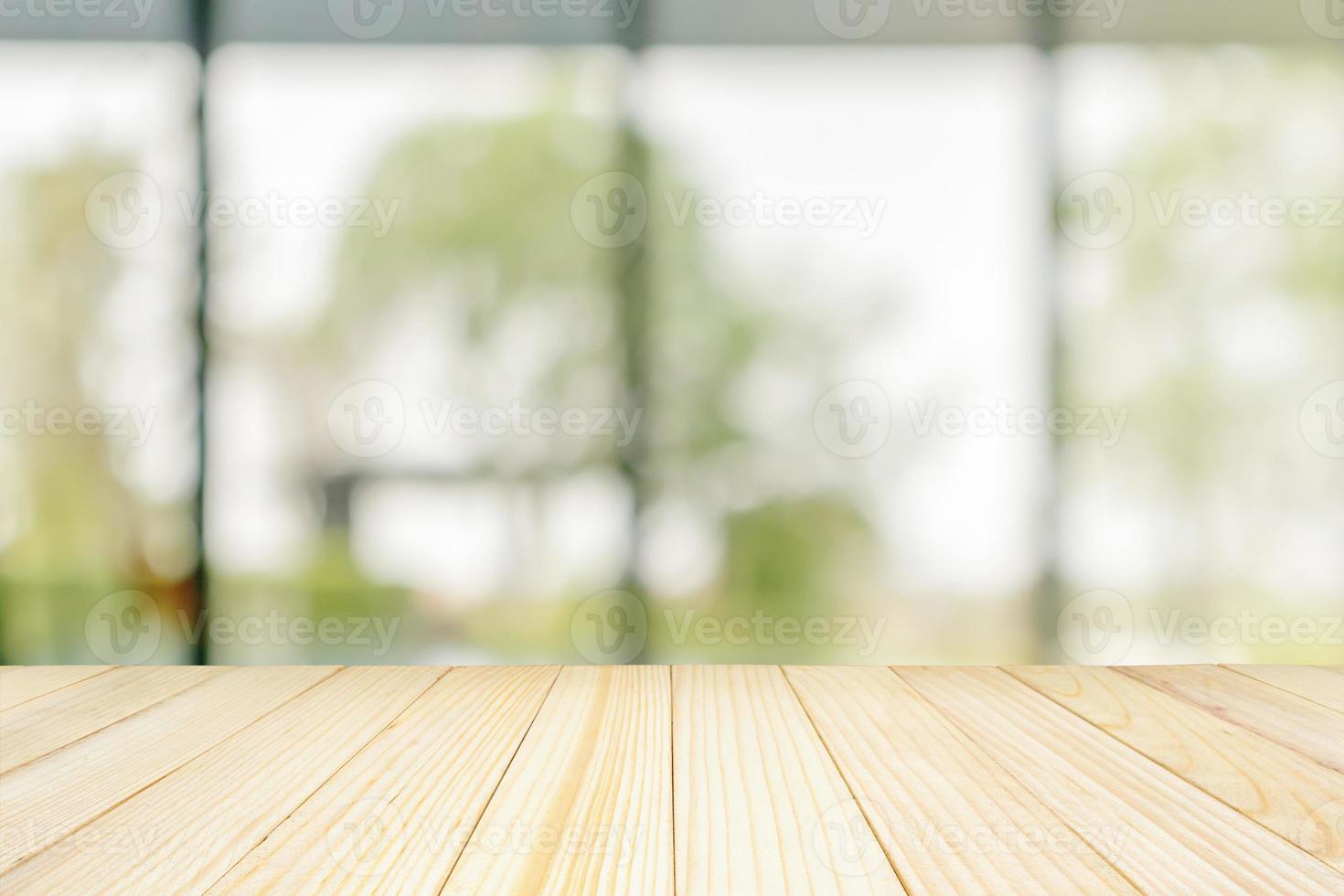 Empty wood table top with blurred window background for product display photo