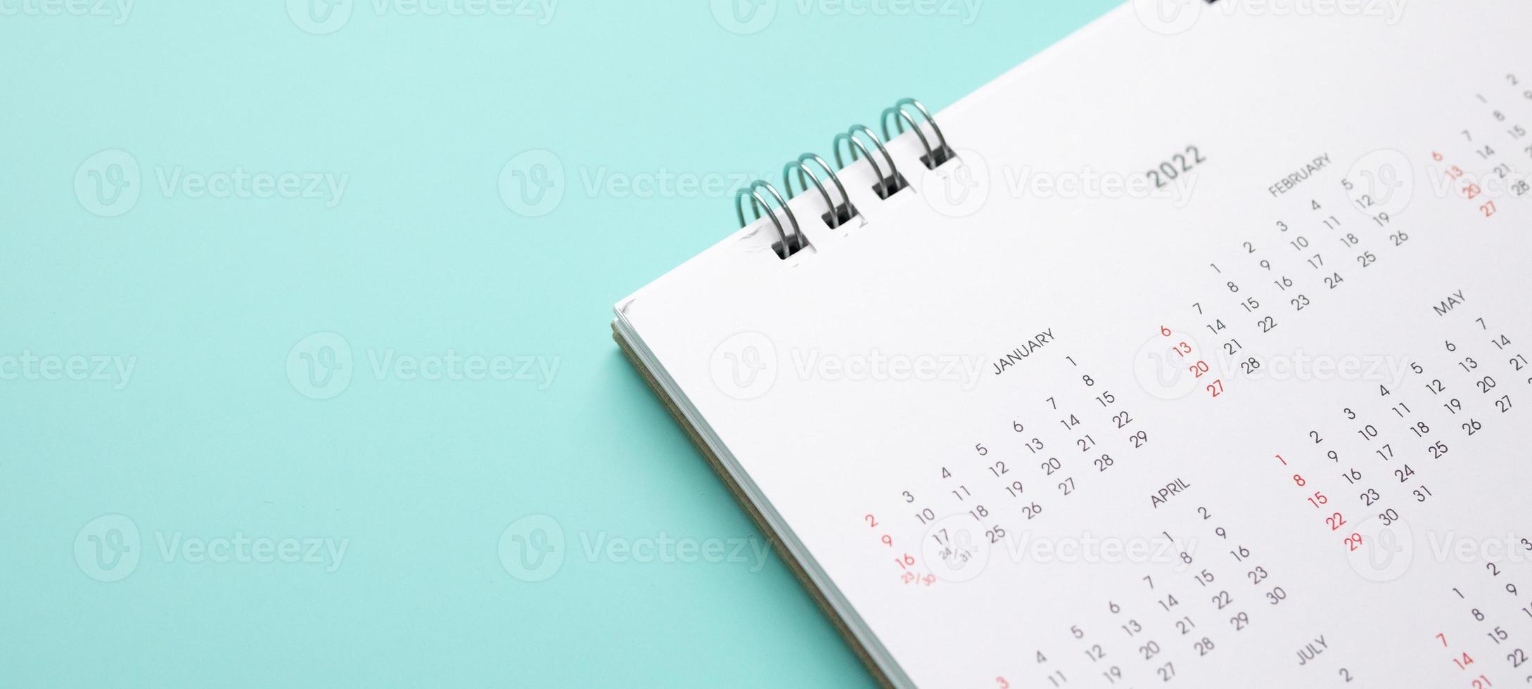 2022 calendar page on blue background business planning appointment meeting concept photo